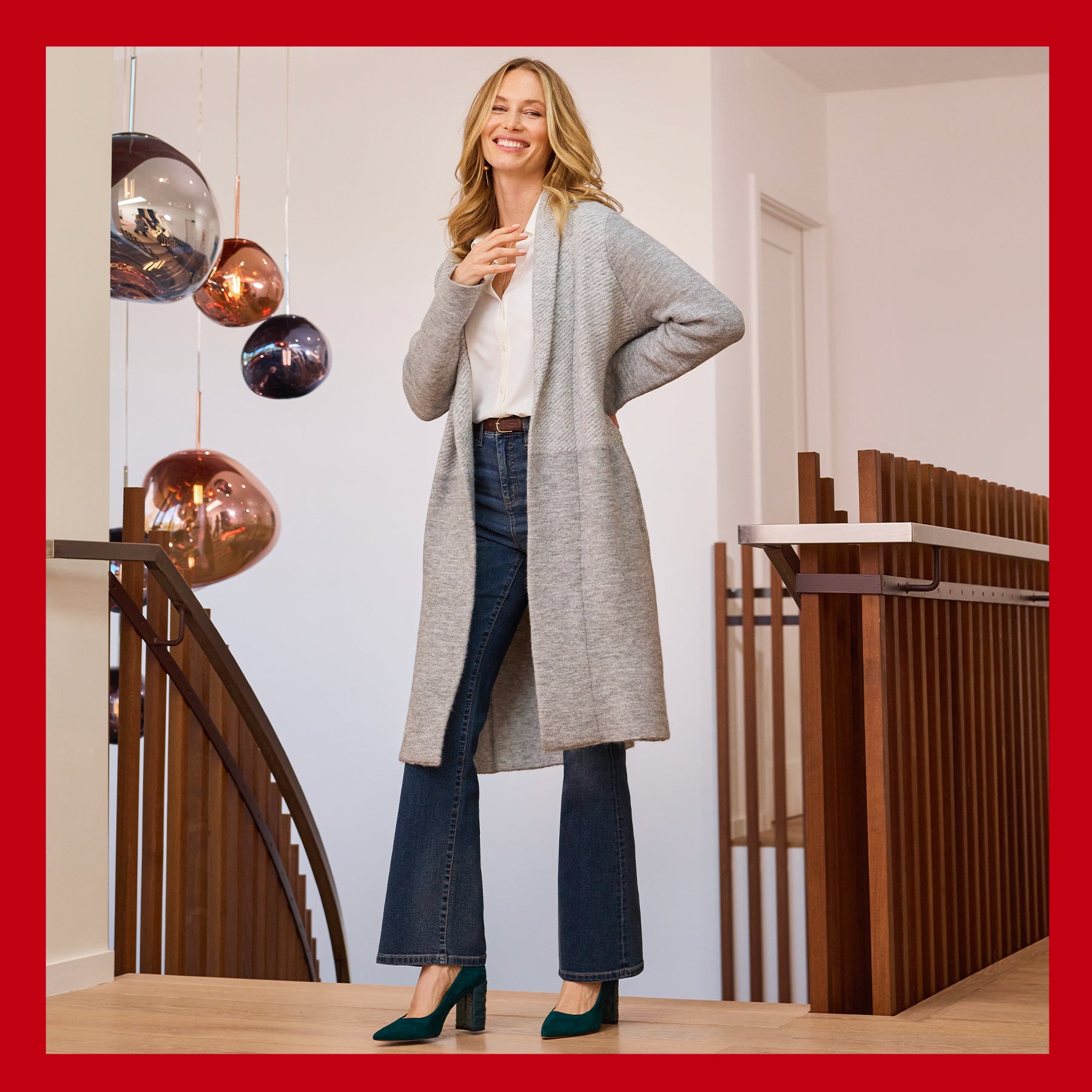 Stylish woman in gray cardigan and jeans indoors.