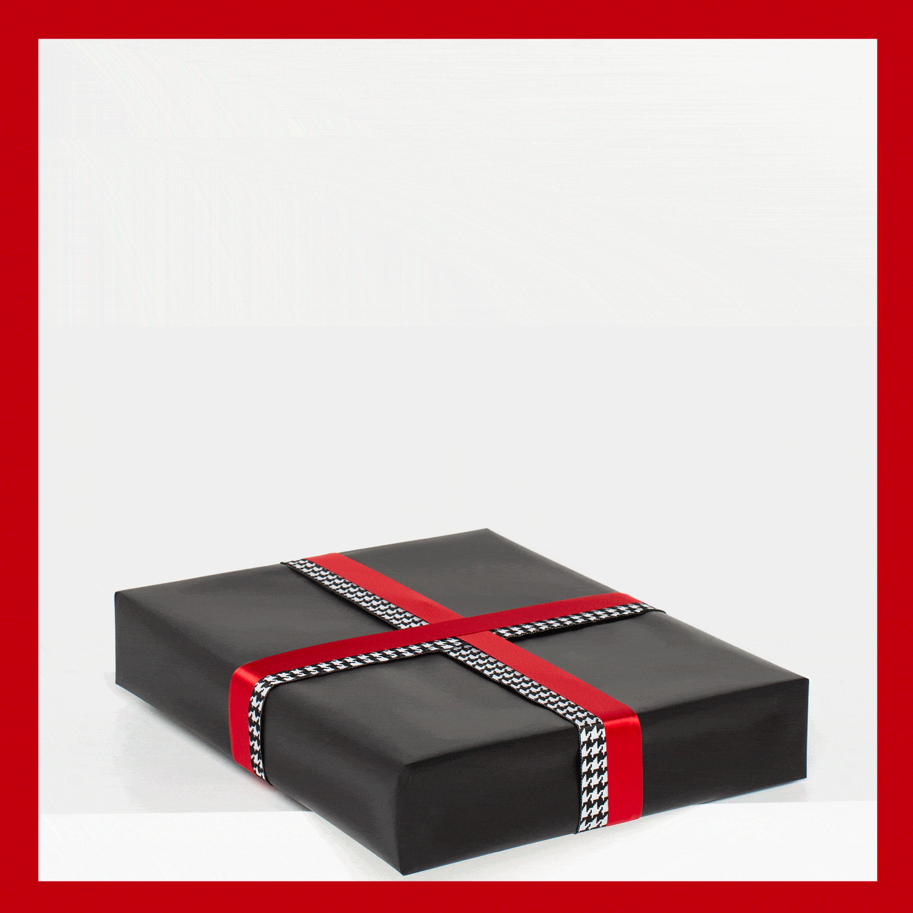 black gift box with red ribbon and houndstooth accent