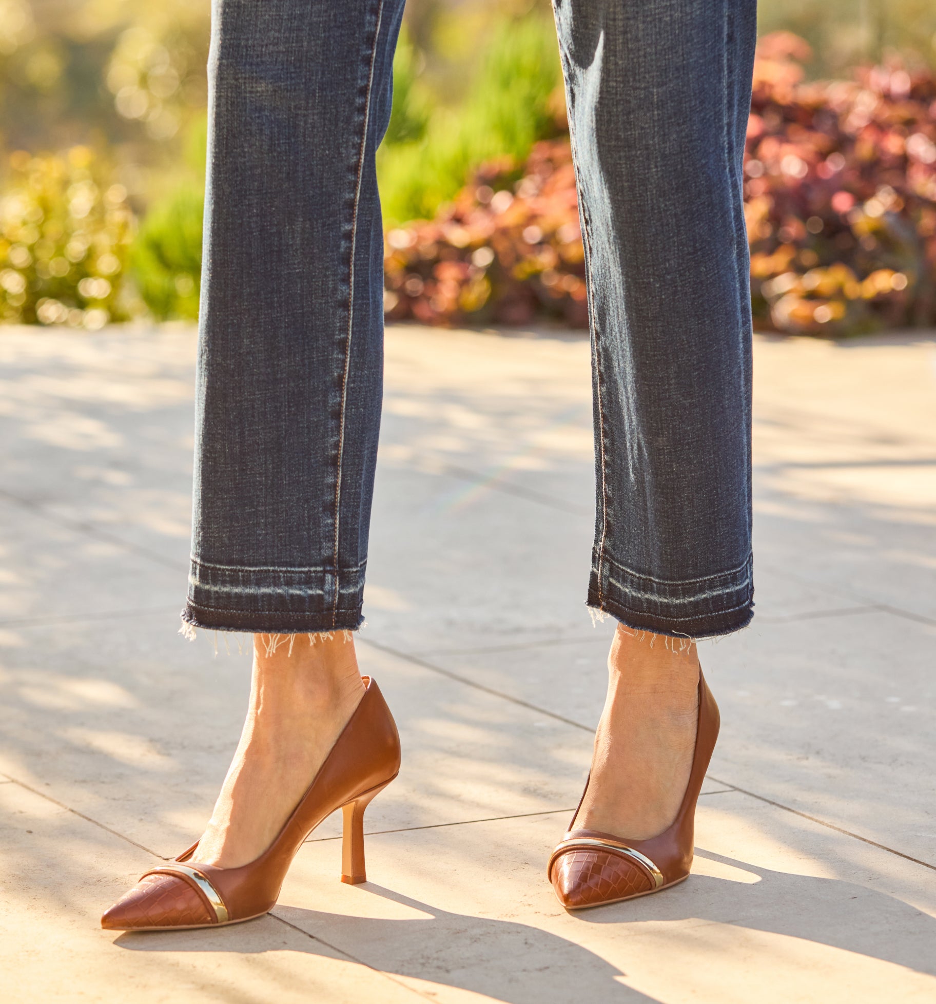woman wearing brown high heels with jeans