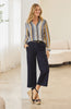 woman fashion outfit striped shirt navy pants sandals