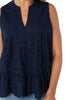 navy blue sleeveless blouse with eyelet design and peplum hem